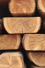 Wooden boards. Woodworking industry. Building materials made of wood.Stacks of lumber are stored in warehouse. Vertical photo.