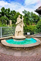 Fountain is a religious statue of a man with a child on his shoulders in Germany