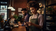 © EmmaStock - young woman barista uses the mobile phone to accept payment from young in the coffee shop