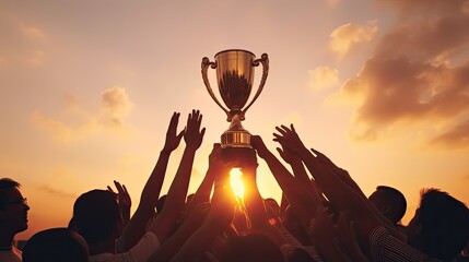 victorious team triumphs under sunset with trophy and numerous silhouetted hands