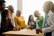 © Vane Nunes - Happy multiethnic people drinking tea during lunch break at work - Group of multi-generational friends having fun laughing together - Soft focus on Asian senior man face
