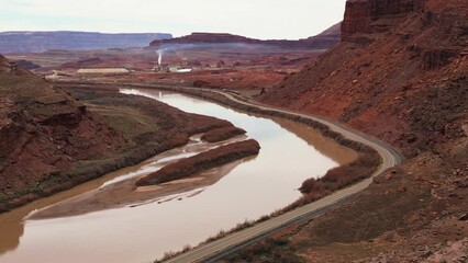 Wall Mural - Moab, Utah, where the landscape has been carved by the Colorado River Erosion, looking at the Red Mudded Colorado River Landscape and the Potash Mine Operation