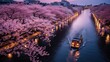 This scene is viewed from a high angle, looking down on a large cherry blossom tree. The river is filled with cherry blossom flurries, and there are large cherry blossom trees on both ends of the rive