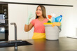 © kues1 - pretty latin woman. housekeeper with clean products.