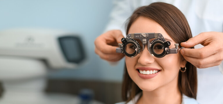Young woman undergoing eye test in clinic