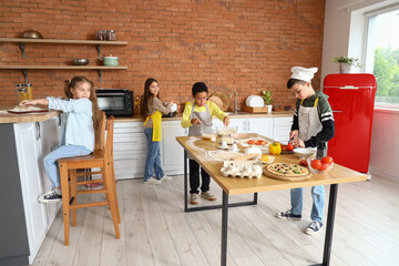 Wall Mural - Little children during cooking class in kitchen