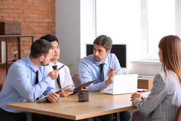 Human resources commission interviewing female applicant in office