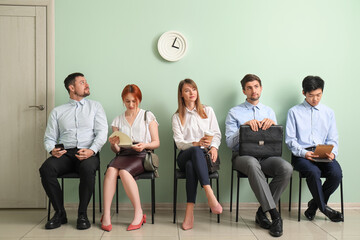 Sticker - Young applicants waiting for job interview in room