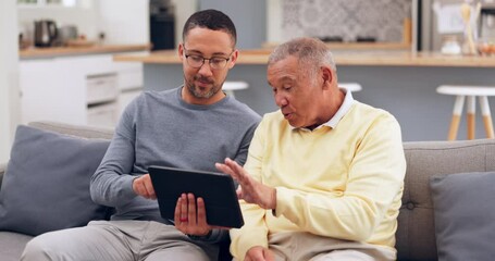 Wall Mural - Tablet, conversation and man with his senior father on a sofa networking on social media together. Digital technology, living room and adult son helping his elderly dad browse the internet at home.