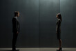 © tiena - Man and woman stand facing each other, sense of confrontation and tension. Conflicts, communication breakdowns, and difficult conversations. Office dynamics, interpersonal relationships. AI generated