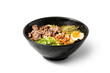 Shoyu Ramen with beef in a bowl on white background.