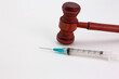 Gavel and syringe symbolize legal and medical connections