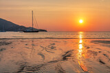 Fototapeta Dmuchawce - Yachts near the tropical sunset beach
