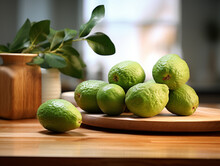 A Close Up Of Feijoa On A Table In A Kitchen With A Shallow Depth Of Field
