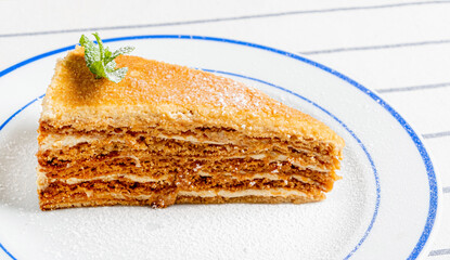 Poster - honey cake on the white plate