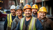 © Adrian Grosu - Happy team of construction workers wearing helmets and smiling