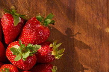 Fresh and juicy organic strawberries on chefs table.