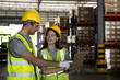 © Jack Tamrong - Warehouse man and woman workers with notebook working in manufacturing contribution  factory warehouse