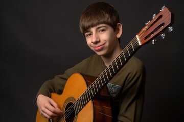 Wall Mural - a young musician striking a pose while holding his guitar