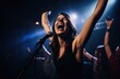 shot of an attractive woman cheering during a music concert