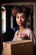 © stickerside - shot of an attractive young woman carrying a box while moving into her new home