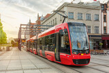 Fototapeta Kwiaty - Red modern tram in the center of Katowice, Poland