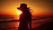 Woman s silhouette watching beach sunset