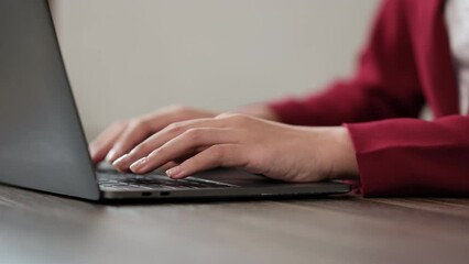 Sticker - Close up of young business woman working and typing on laptop with happy on office