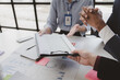 © PHOTO4U - The sales department is having a monthly summary meeting to bring it to the department manager, they are verifying the correctness of the documents that are prepared before bringing in to the manager
