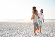 © Davids C/peopleimages.com - Gay couple, space and piggyback with family at beach for seaside holiday, support and travel mockup. Summer, vacation and love with men and child in nature for lgbtq, happiness and bonding together