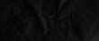 © Grave passenger - Texture of black crumpled paper, black crumpled paper texture in low light background,dark paper background with chaotic bends, black wrinkled paper texture.