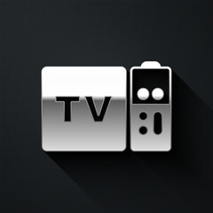 Canvas Print - Silver Multimedia and TV box receiver and player with remote controller icon isolated on black background. Long shadow style. Vector