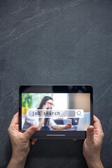 Wall Mural - top view of digital tablet with search job on screen in male hands.