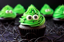 Halloween Monster Cupcake With Green Frosting And Funny Eyes