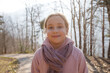 © millaf - Cheerful child girl in purple scarf outdoor portrait