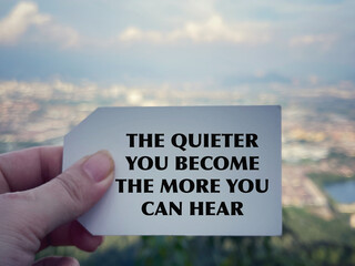 Wall Mural - Motivational and inspirational wording. The Quieter You Become, The More You Can Hear. Blurred styled background.