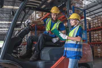 Foreman Caucasian Forklift Driver Talking to Female Workers Wearing Safety Uniforms and Helmets Discussing Cargo Shipment in Auto Parts Factory