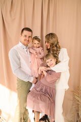 Wall Mural - happy family of four father with mother and two daughters