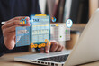 © Wanan - Tax concept. Person using computer to fill out personal income tax return to pay taxes online. State tax. Financial research. data analysis, documents, reports, tax returns, calculations.