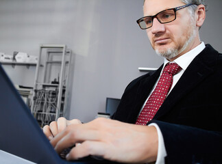 businessman with laptop in office