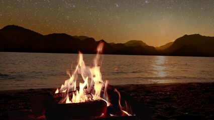 Wall Mural - a bonfire burns at night against the background of mountains and sea with bright stars