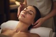 © Jorge Ferreiro - young woman receiving facial massage at spa