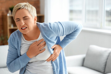 Poster - Mature woman having heart attack at home