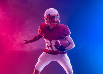 Wall Mural - American football player banner with neon lights. Template for a sports magazine on the theme of American football with copy space. Mockup for betting ads.