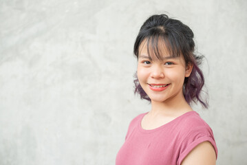 Wall Mural - Happy teen girl 11-15 year old. Portrait beautiful woman smiling with perfect smile and white teeth. asian lady girl wear casual cloth with smiling looking at camera on gray background.