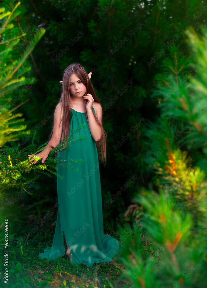 Portrait of a beautiful girl in a green dress on nature. Stock Photo ...