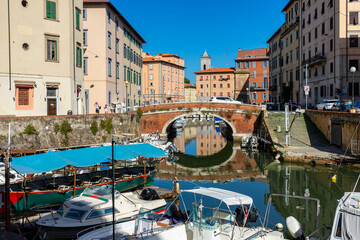 city canal in livorno, italy