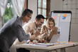 © SOMKID - Group of business team working with analysis financial data visualization tech for marketing strategy, Businesswoman accountant or financial report graph at desk in corporate office.