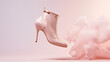 Flying fashionable women's stiletto heels boots isolated on pink background