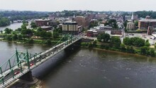 Aerial View Of Easton PA And Delaware River Approaching City Next To The Bridge Over The Water